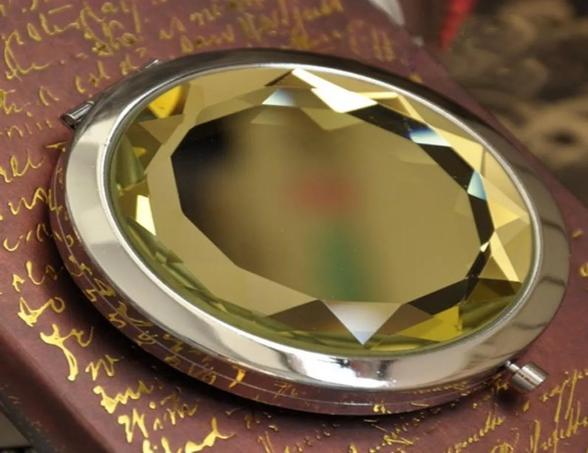 Specchio compatto per trucco pieghevole da 100 pezzi 7 cm con specchio tasca in metallo in cristallo per regalo 22285572
