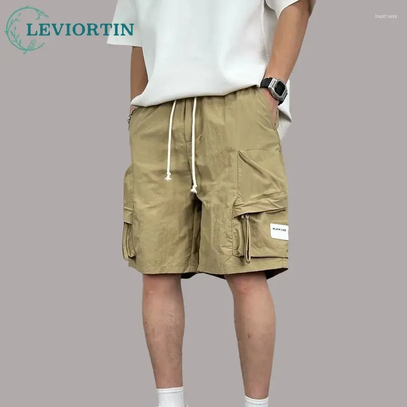 Short masculin cargo séchage rapide avec couleur d'été à poche couleur unie simple simple occasionnelle à la mode mince pantalon à cinq points