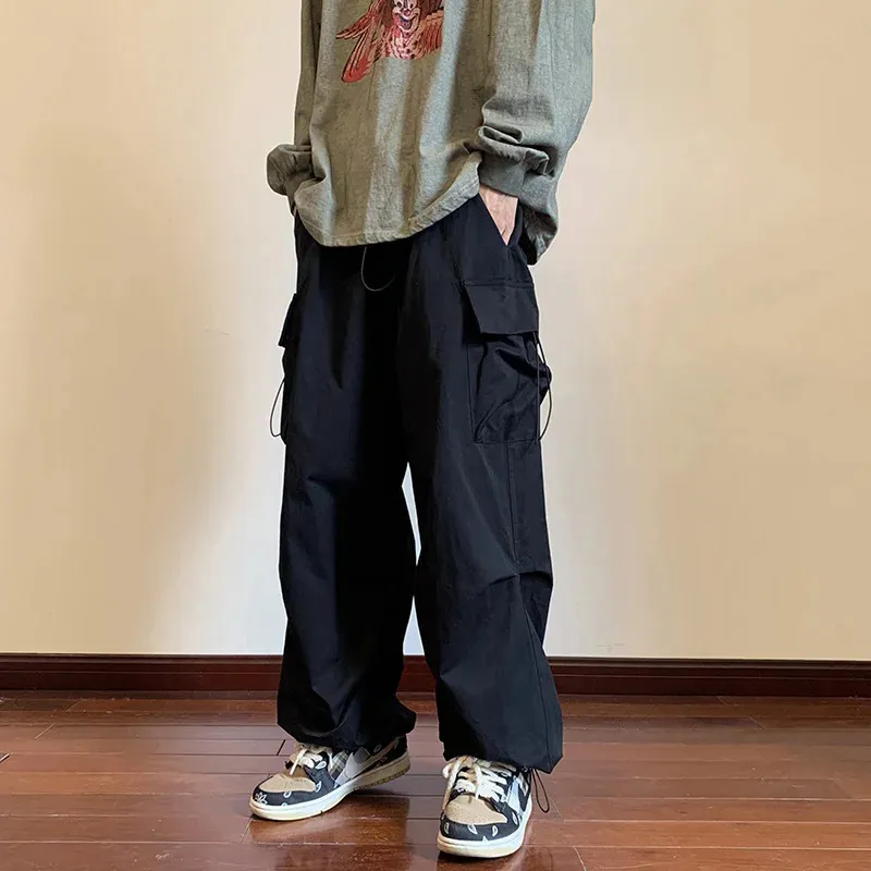 Pantalons de cargaison Men Streetwear Hip Hop Pantalon Élastique taille Harem Longue Longueur Black Harajuku Pocket Casual Pocket Femmes 240409