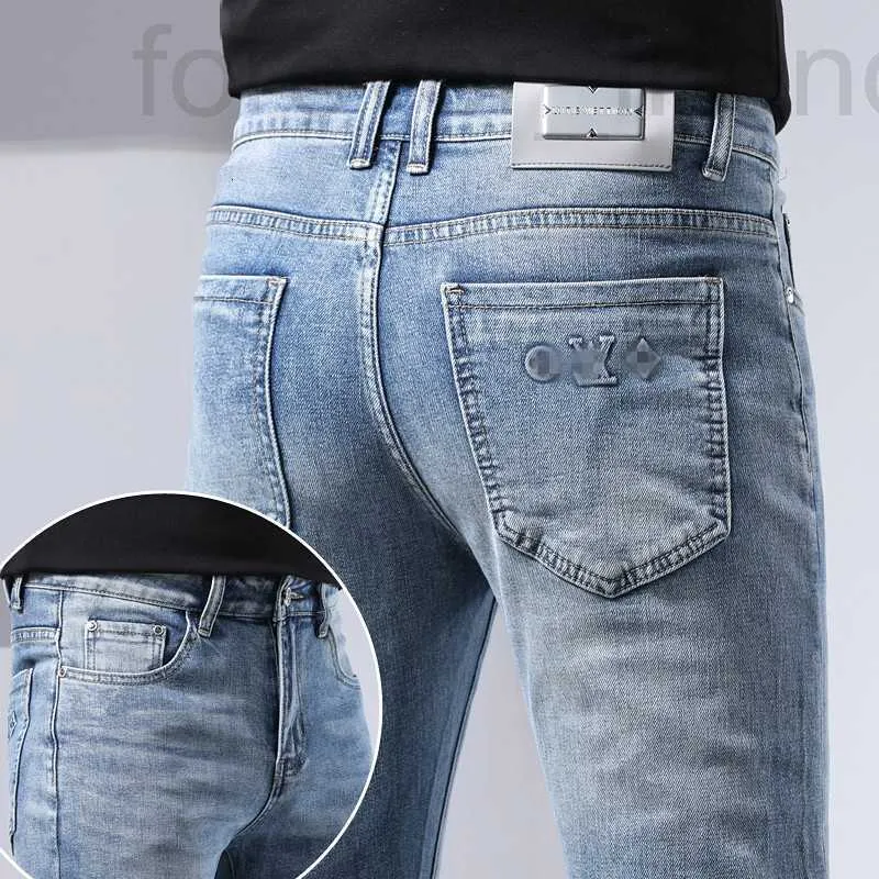 Men's Jeans designer Guangzhou Xintang Light Blue Slim Fit Small Feet High end Spring Thin Long Pants 28MW