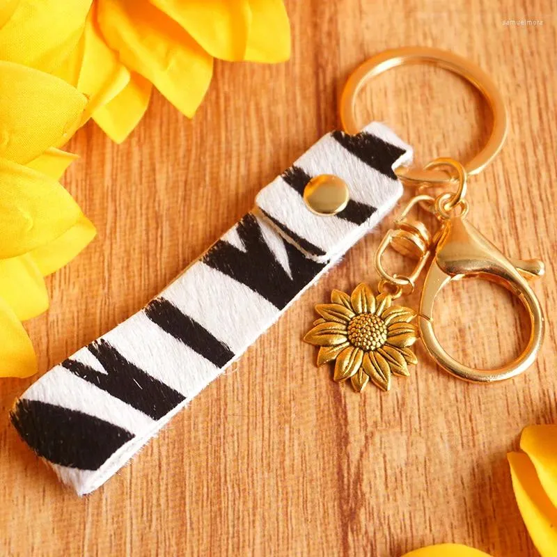 Keechains Leather Key Chain Key Unisex Zebra Cow Leopard Stampa in metallo Girasole fai -da -te alla moda Boemia Casual Fashion Originalità Auto