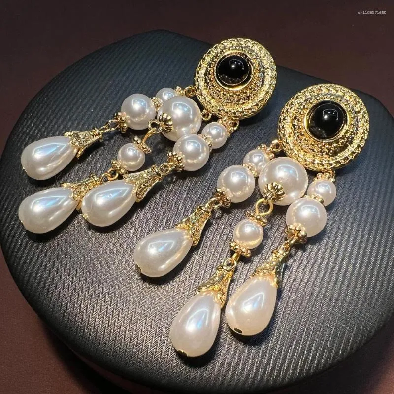 Intricate design pearl tassel earrings discount