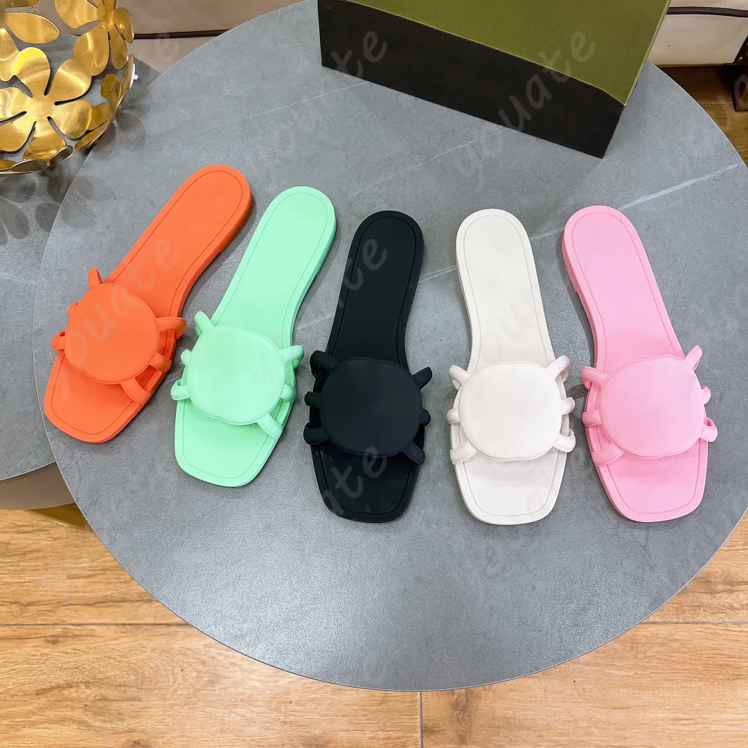 2024 Designer Sandalen vrouwen in elkaar grijpen G -glijbanen rubber slippers dames plat strand jelly script oranje zomer herfst muildieren buiten waterdicht slipper