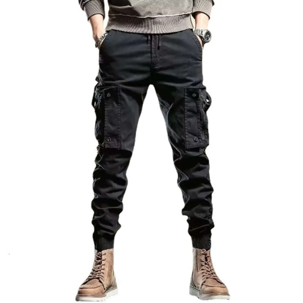Wiosenne i jesienne modne marki Męskie spodnie robocze Slim Fit Tie stopy pi shuai długie spodnie zimowe amerykańskie motocykl multi torba czarne spodnie