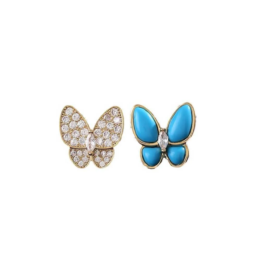 Projektant urok Wysokiej klasy wszechstronny temperament Łagodne niszowe kolczyki Van Butterfly Asymetryczne niebieskie emaliowane pełne diament dla kobiet biżuteria