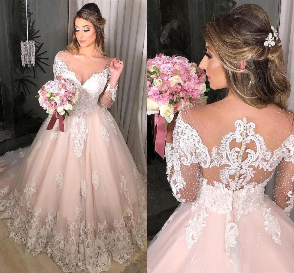 Blush Pink A-Line Long sleeve wedding dresses with Sheer Neckline, Long Sleeves, Appliques, Buttons, Back Beads, and Sequins - Perfect for Engagement