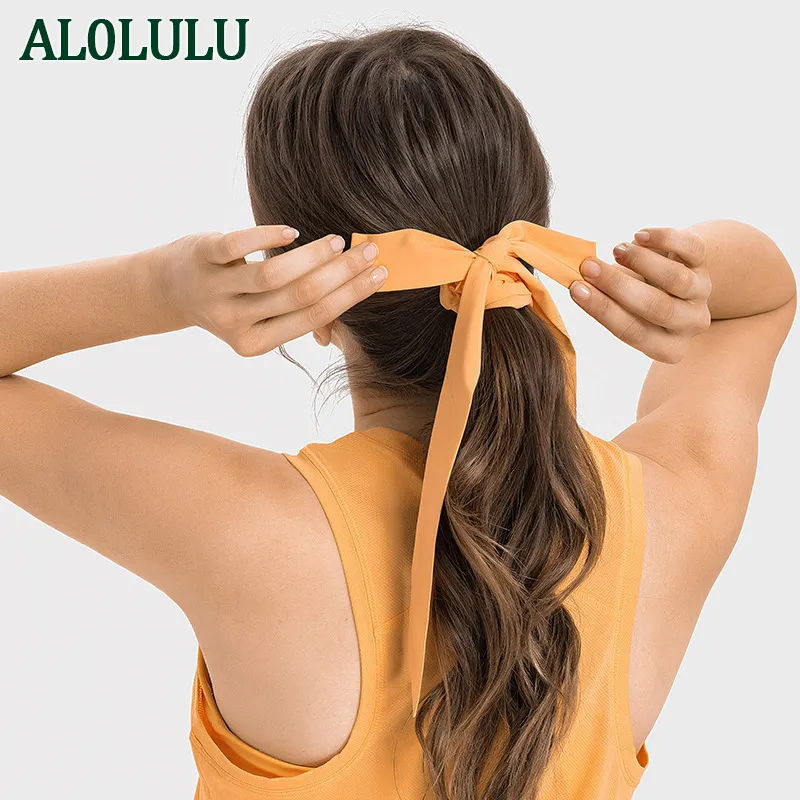 Al0lulu met logo vochtafwijkend sport tulband verstelbare stropdas boog yoga hoofdband