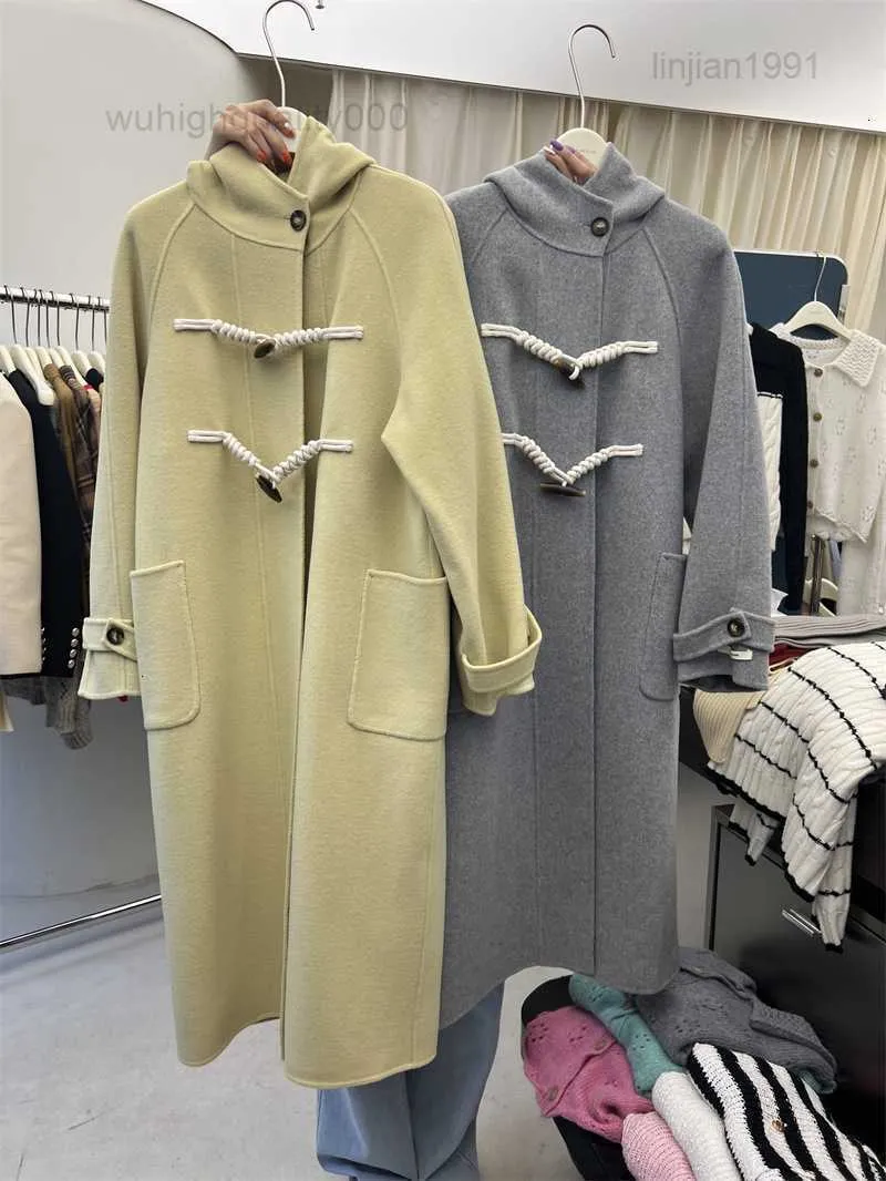 AK Light Luxury Double Sided Cashmere Coat Womens Autumn/Winter Korean Edition Hooded Cow Horn Button Design Medium Längd ull