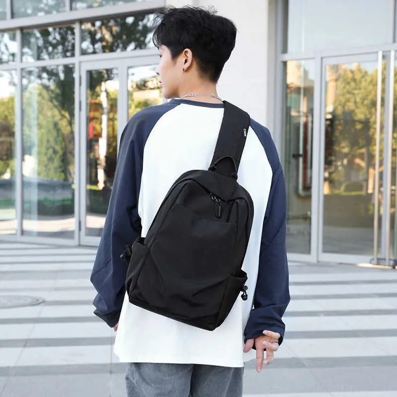 Un Bolso De Hombro Cargado De Poliéster De 14 Pulgadas A Prueba De Salpicaduras Bolso De Escuela De Estudiante Simple De Moda Gris