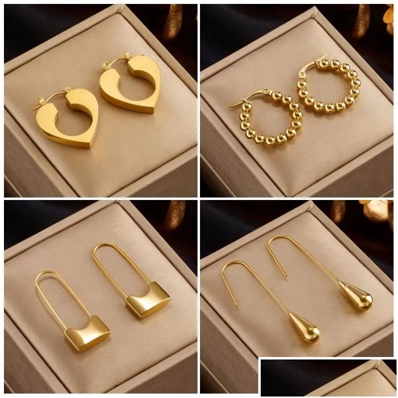 Boucles d'oreilles de cerceau de verrouillage de coeur doré 14k.