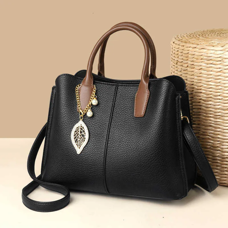 Väska kvinnors stora mode hink arbetande pendlare mångsidig trendig stor kapacitet crossbody handväska