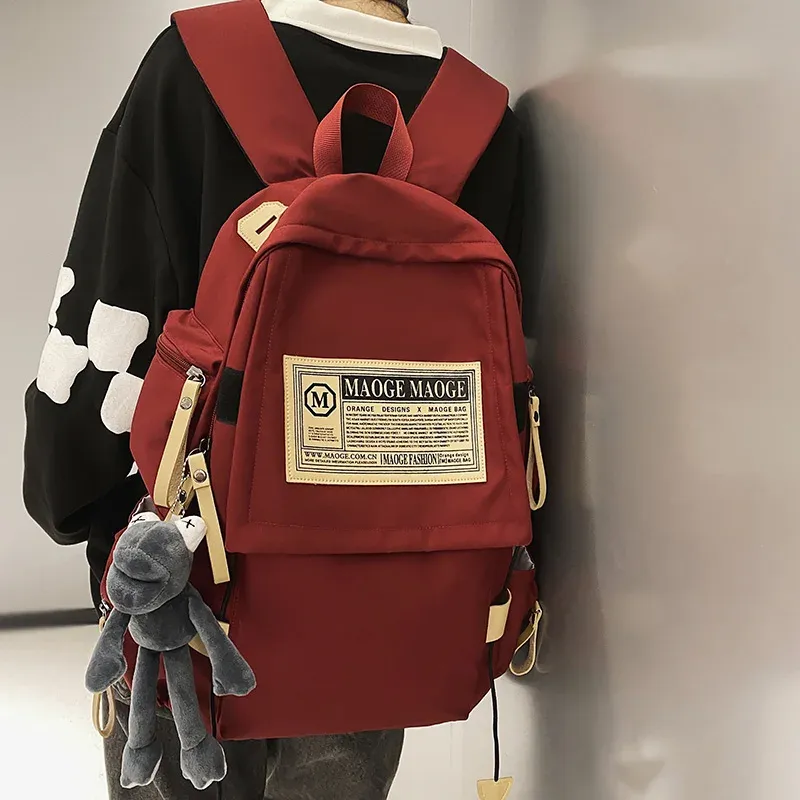 Väskor dam manlig röd nylon skolväska cool pojke tjej vattentät resa bok väska män kvinnlig fritid bärbar college ryggsäck mode