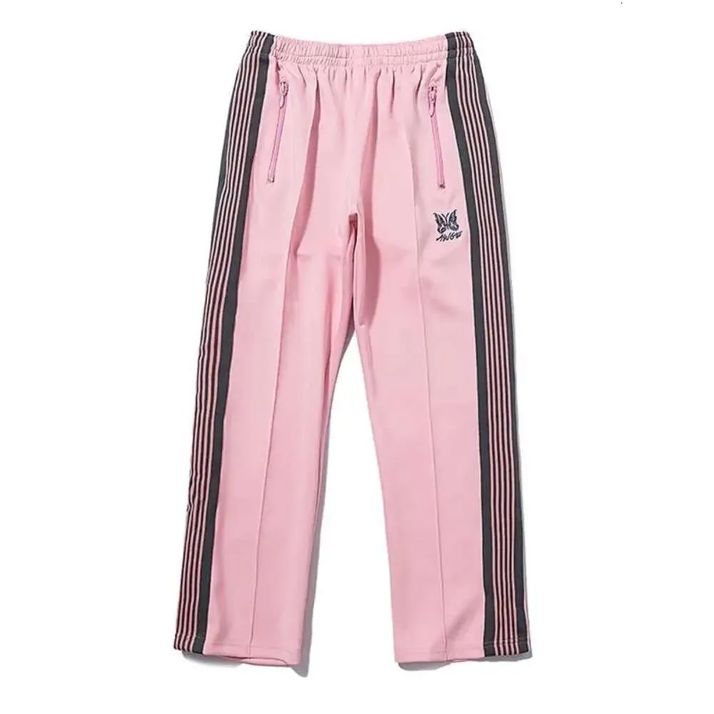 Calças de agulhas moda calça de moletom de borboleta bordada lateral lateral homens mulheres calças longas calças de cordão de rua masculino masculino masspantes de alta qualidade