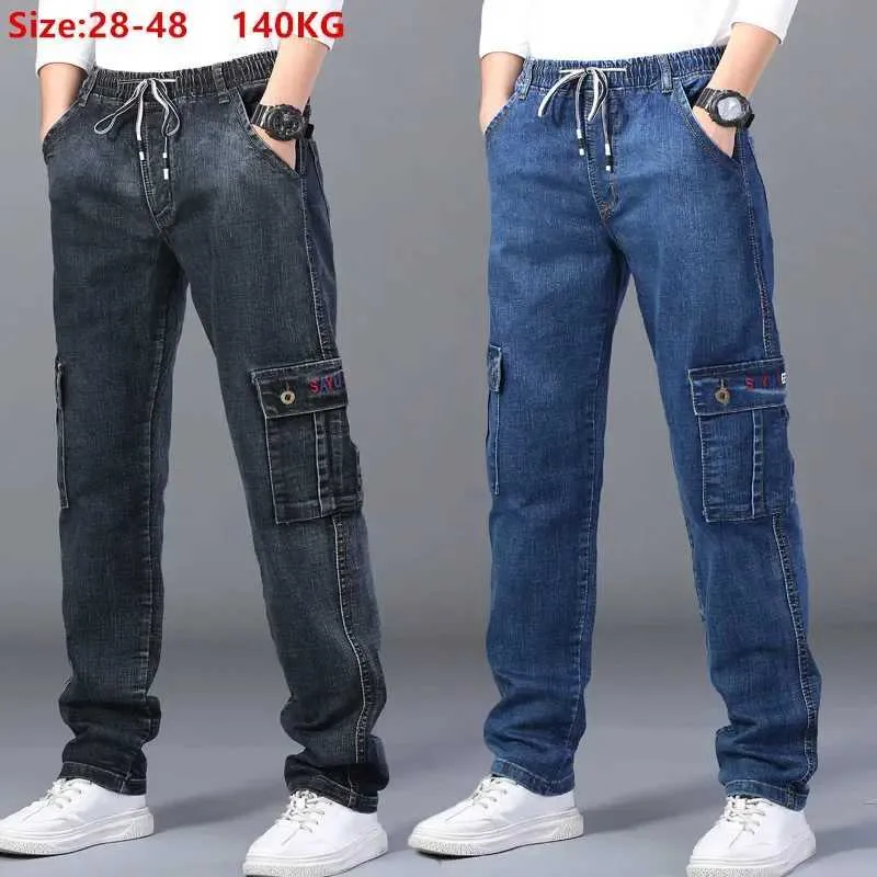 Herr jeans last jeans män elastiska plus storlek 48 46 44 42 hög midja byxor raka arbete byxor avslappnad sträckt svart denim streetwear 240423