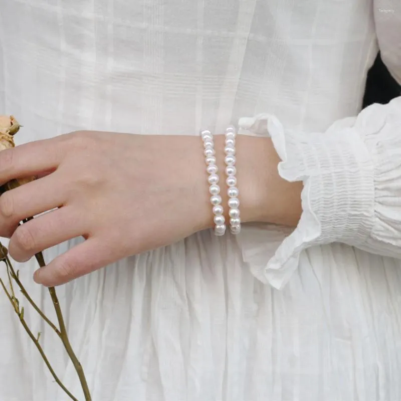 Brin 7 à 8 mm blanc près de rond les perles d'eau douce naturelles bracelet simple femelle élastique fait à la main gift fempère des femmes
