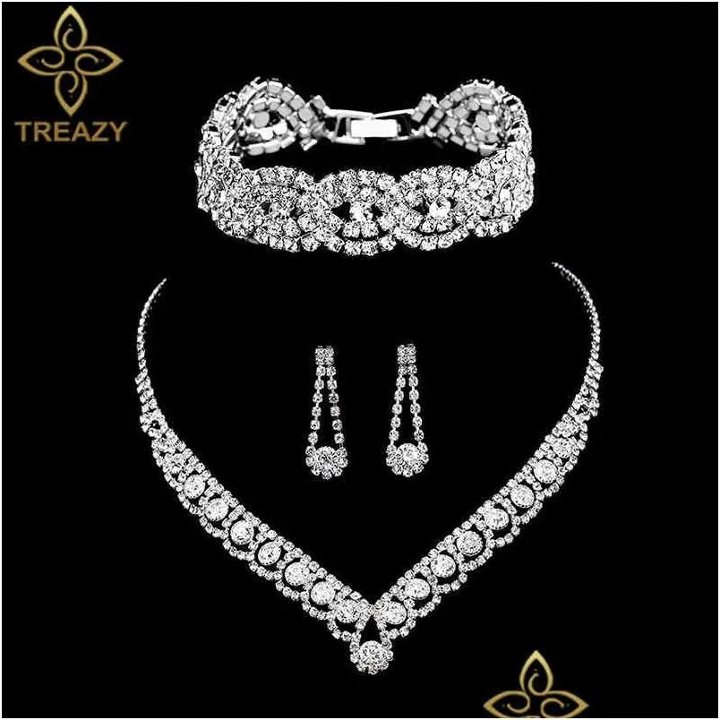 Ensemble de bijoux Bangle Designer Traizy Sier Color Rhingestone Crystal Bridal pour femmes Collier Boucles d'oreilles Bracelet Set Drop Lipt Otqsu