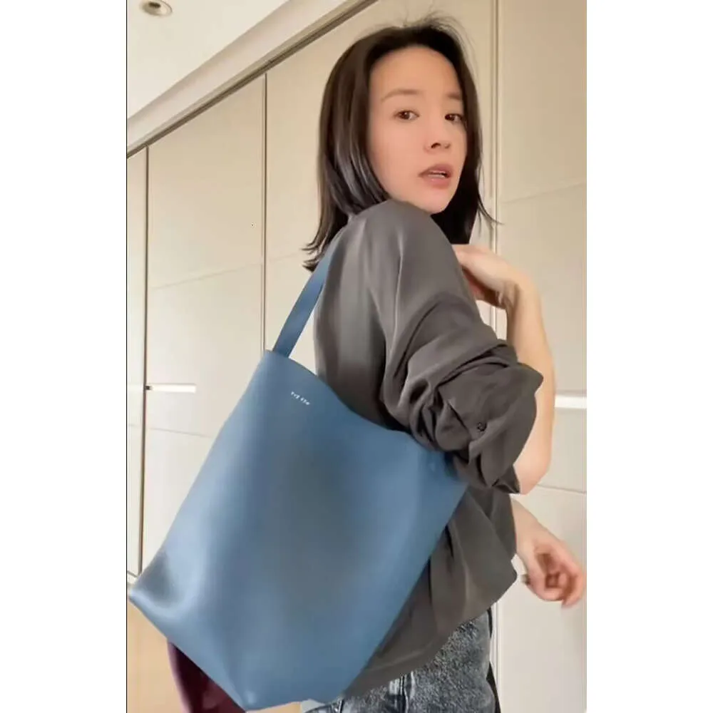 Jie The Lazy Row Pending Bag Tote Dong stor kapacitet One Shoulder Handheld Cowhide Bucket Tote Womens Bag 4 1ppy