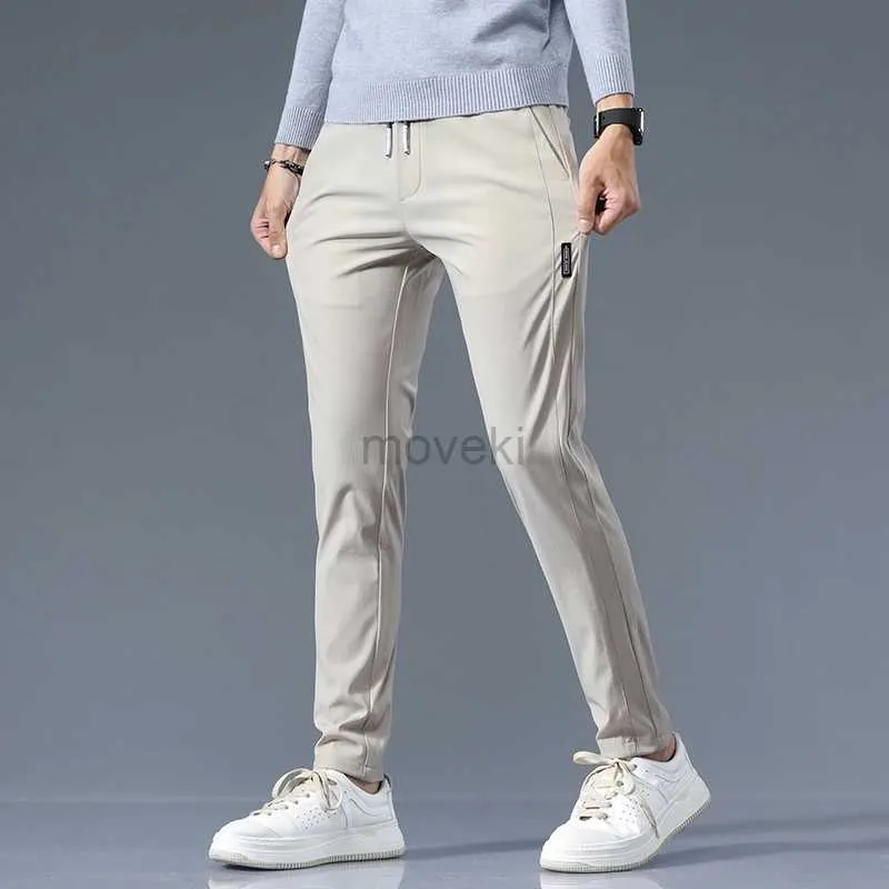 Pantalones para hombres estirando pantalones casuales hombres clásicos de ajuste delgado de peso liviano para hombres joggers sencillos sólidos pantalones de color caqui sólido D240425