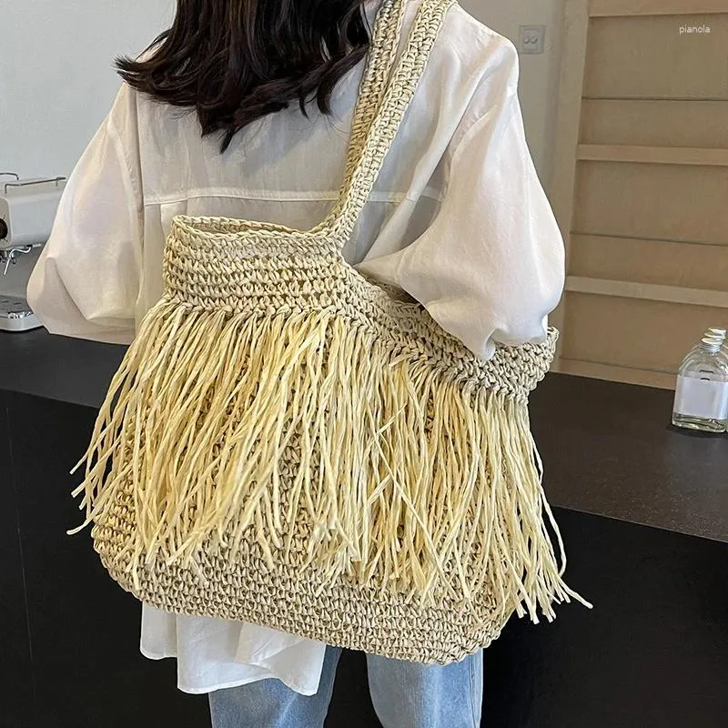 Drawstring Bohemian Tassel Hollow Tote Bag Designer Straw Woven Women Handväskor Sommarstrandsäckar Casual Bali axel