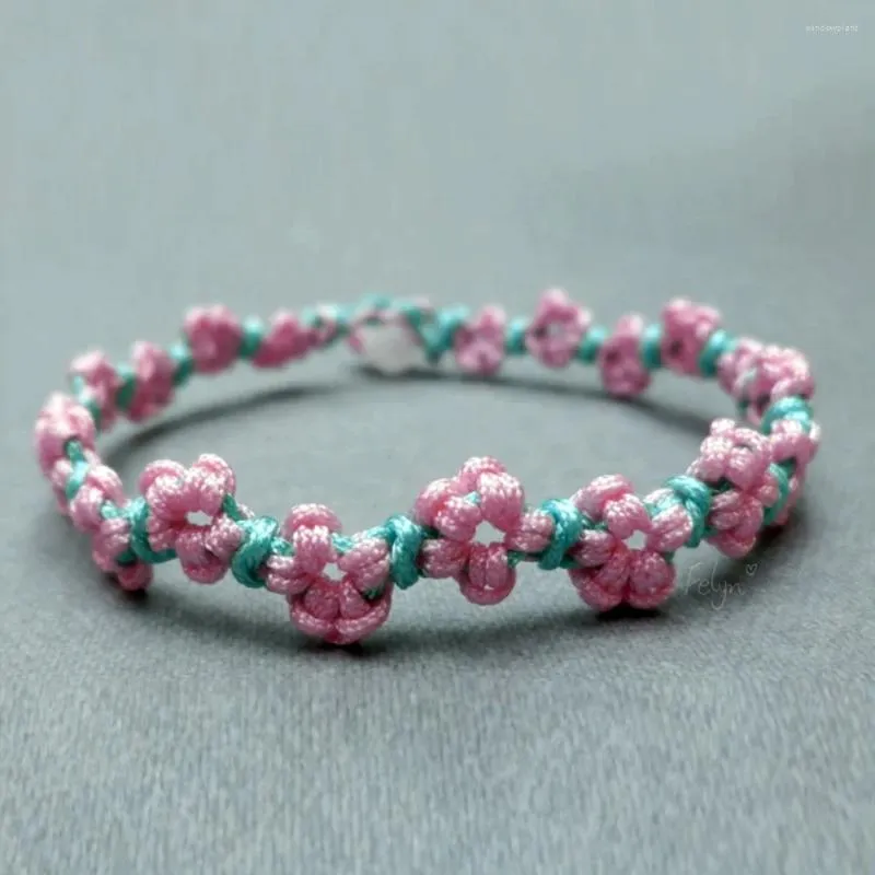 Bracelet de tissage de fleur de pêche à la pêche à la corde à la main de charme de fleur de printemps ajusté à la main