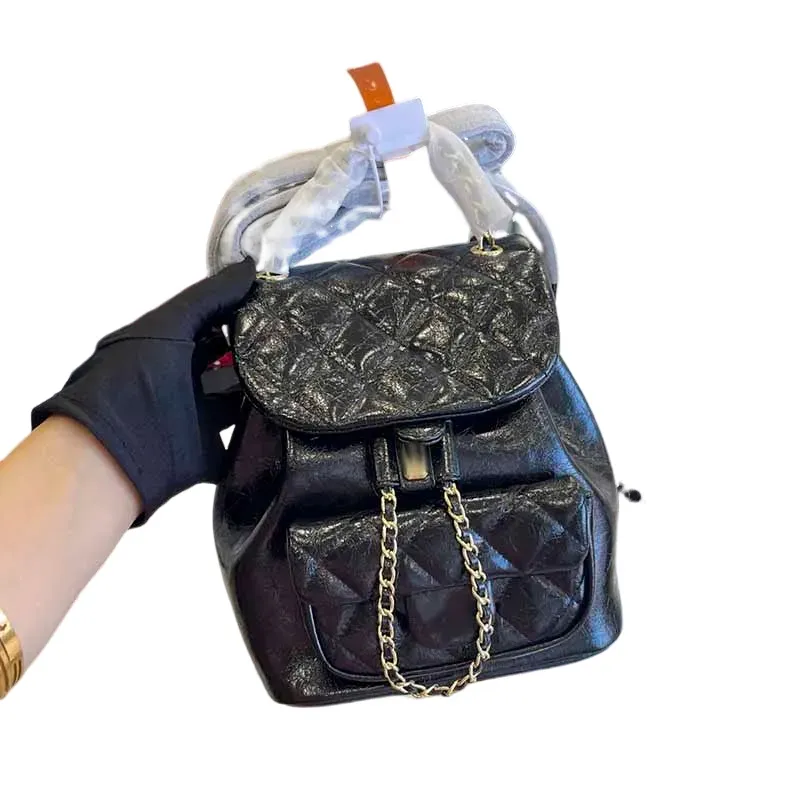 24p vintage kvinnor klaffar ryggsäck designer väska 7a högkvalitativ oljevax kalvskinn axelväska handväska guld läder kedja diamant quiltning korskropp