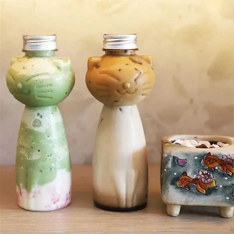 Tumblers Linda botella de agua en forma de gato utilizada para té de leche jugo de café con tazas portátiles de bebidas portátiles botellas transparentes bpa h240425