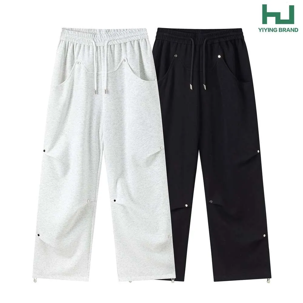 Design de niche de base minimaliste coréen avec un pantalon décontracté plissé rivé pour hommes et femmes, jambe droite, ajustement lâche et pantalon long polyvalent