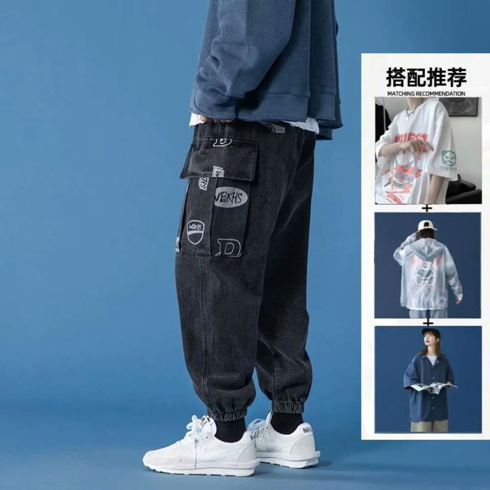Immagine in rete di grandi jeans da lavoro tascabile per uomini, leggings allentati, pantaloni papà alla moda in stile sottile estivo, High Street