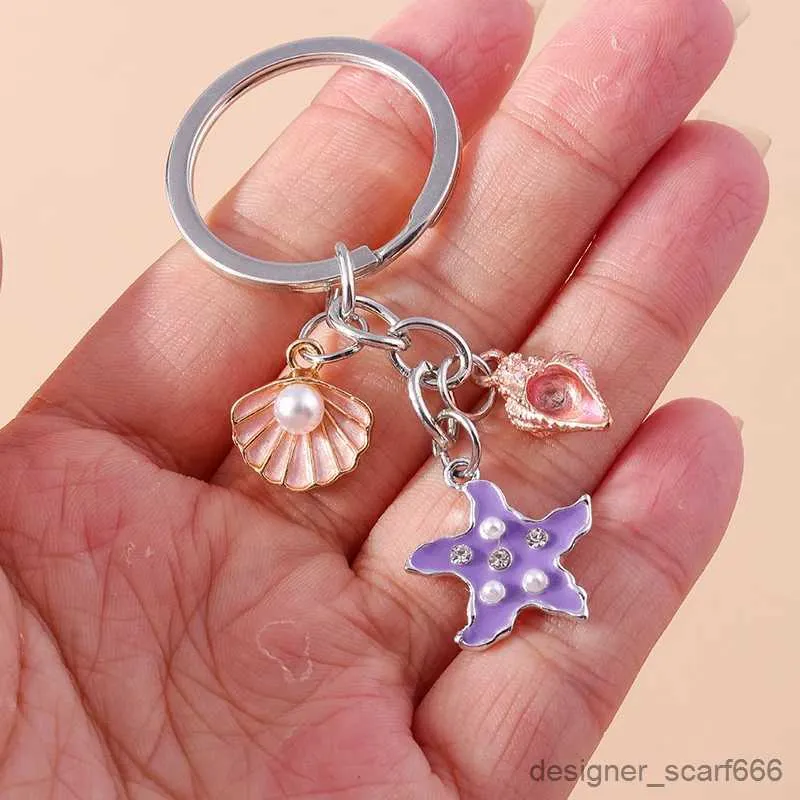 Keychains Lanyards süße Schlüsselanhänger Emaille Sommer Beach Seestarfish Muschel Anhänger für Frauen Männer Auto Schlüssel Handtasche Anhänger Schlüsselketten DIY -Geschenke