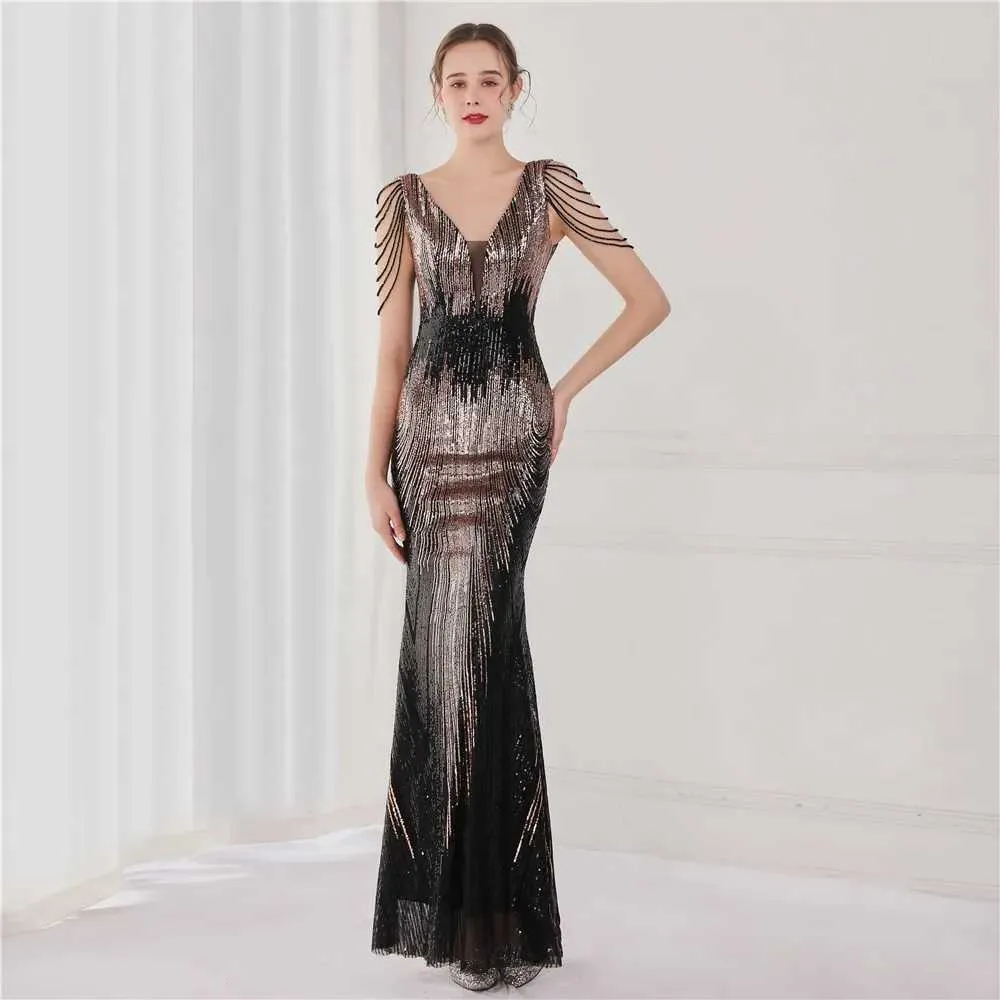 Sequin maxi dress with beaded detailing for women's prom, evening and party wear. Sequin maxi dress with beaded detailing for women's prom, evening and party wear.