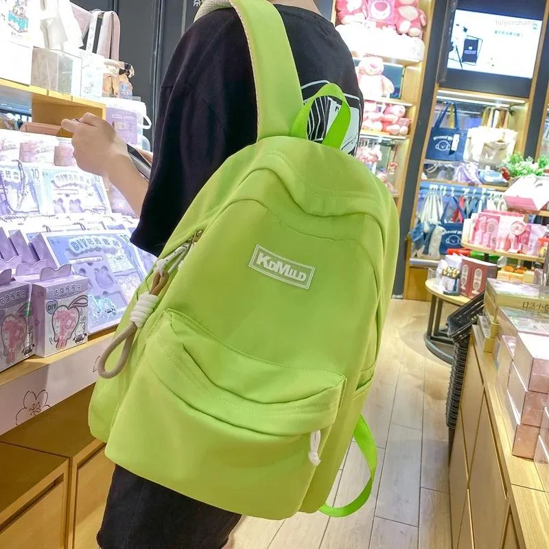 Sac à dos mode fluorescent vert kawaii femelle solide mignonne fille fille femme imperméable en nylon sac à école masculine livre de voyage