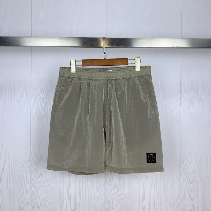Designer Herren Shorts Stone Summer Casual Metal Nylon Kompass Kleiner Label Sport Casual Quick Trockning Shorts Loose Quarter Pants XJ01