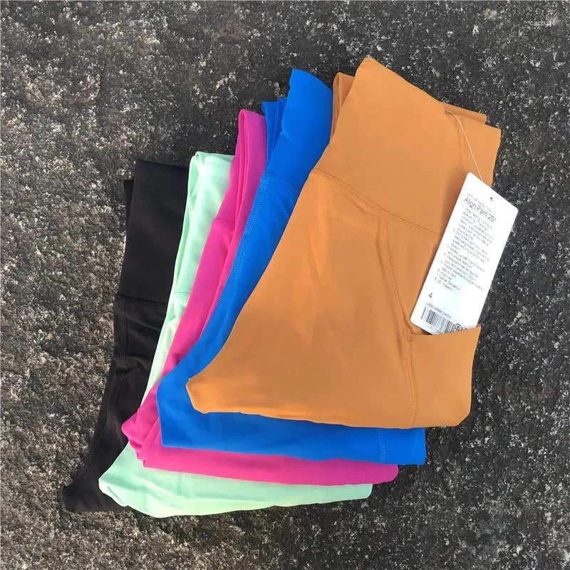 Pantaloni attivi di colore solido di buona qualità di alta qualità con leggings da yoga laterale Pocket Fitness Women Sports Pant Pant Fallo di allenamento completo Compressio