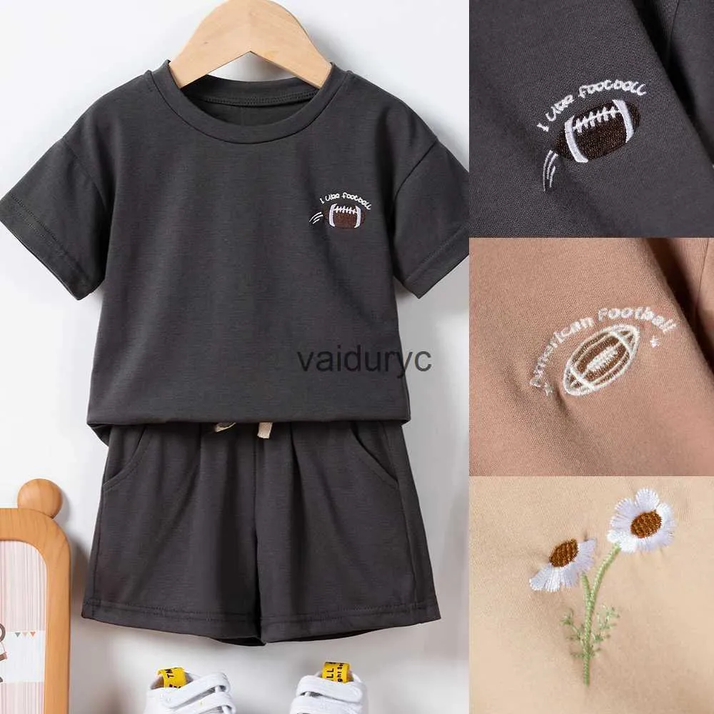 Vêtements Sets New Summer Ldren 2PCS Sets Boys Girls Girls Short Sleeve Rugby / Daisy broderie T-shirt + Shorts solides 2pcs Set Kids Leisure Suits H240429