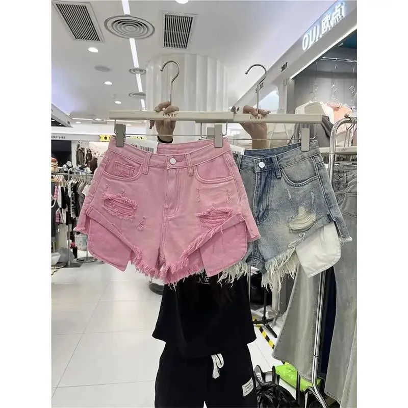 Shorts voor dames sexy blauwe denim shorts vrouwen zomer 2024 nieuwe losse gat burr een brede pijpen hot pants y2k shorts jeans feminino y240425