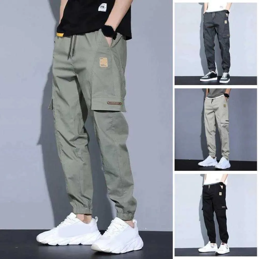 Calça masculina calças de comprimento de tecido macio de vários bolsos elásticos da cintura e de verão