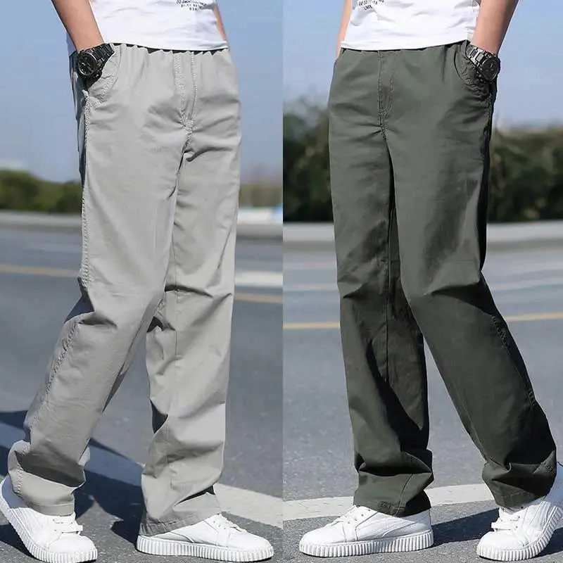Spodnie męskie Męskie sprężyste/letnie spodnie towarowe bawełniane spodnie robocze nowe luźne i luźne dopasowanie do powolnych biegaczy Korean plecak Travellersl2404