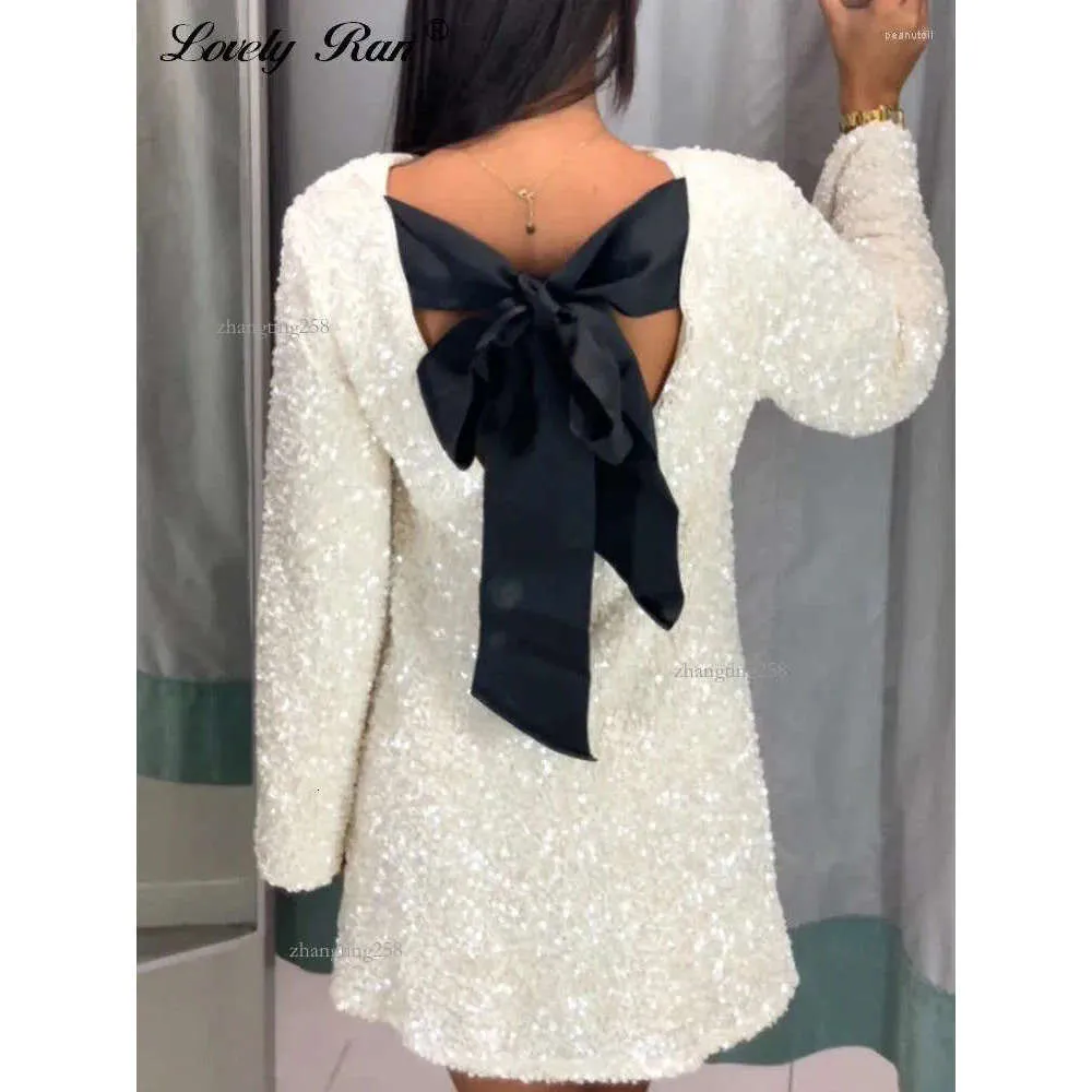 white sequin long sleeve bow mini dress Irina White Sequin Mini Dress with Black Bow S