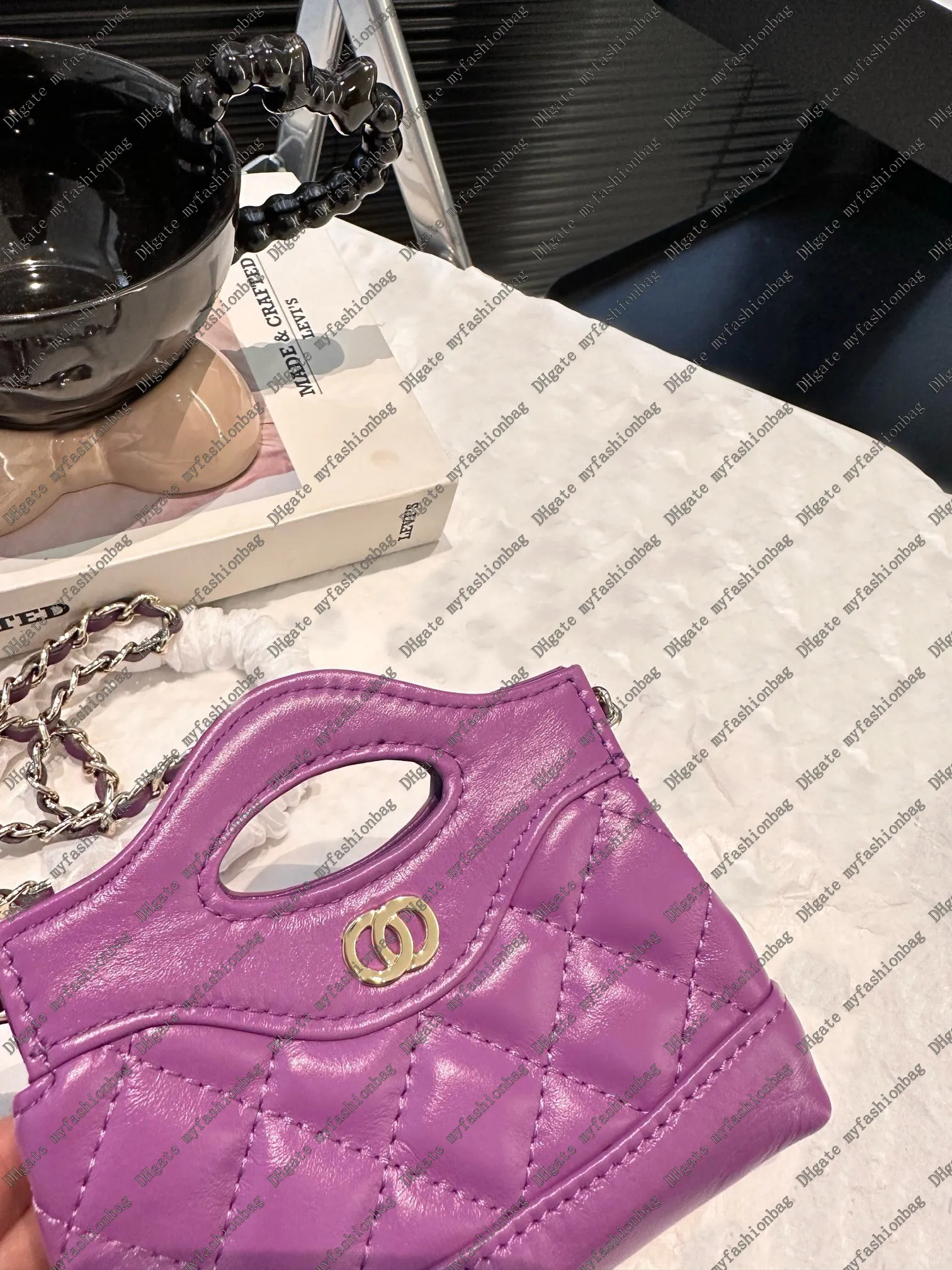 Diseñador Nano Bag Bag Mini Material de cuero genuino Material de cuero de alta calidad.