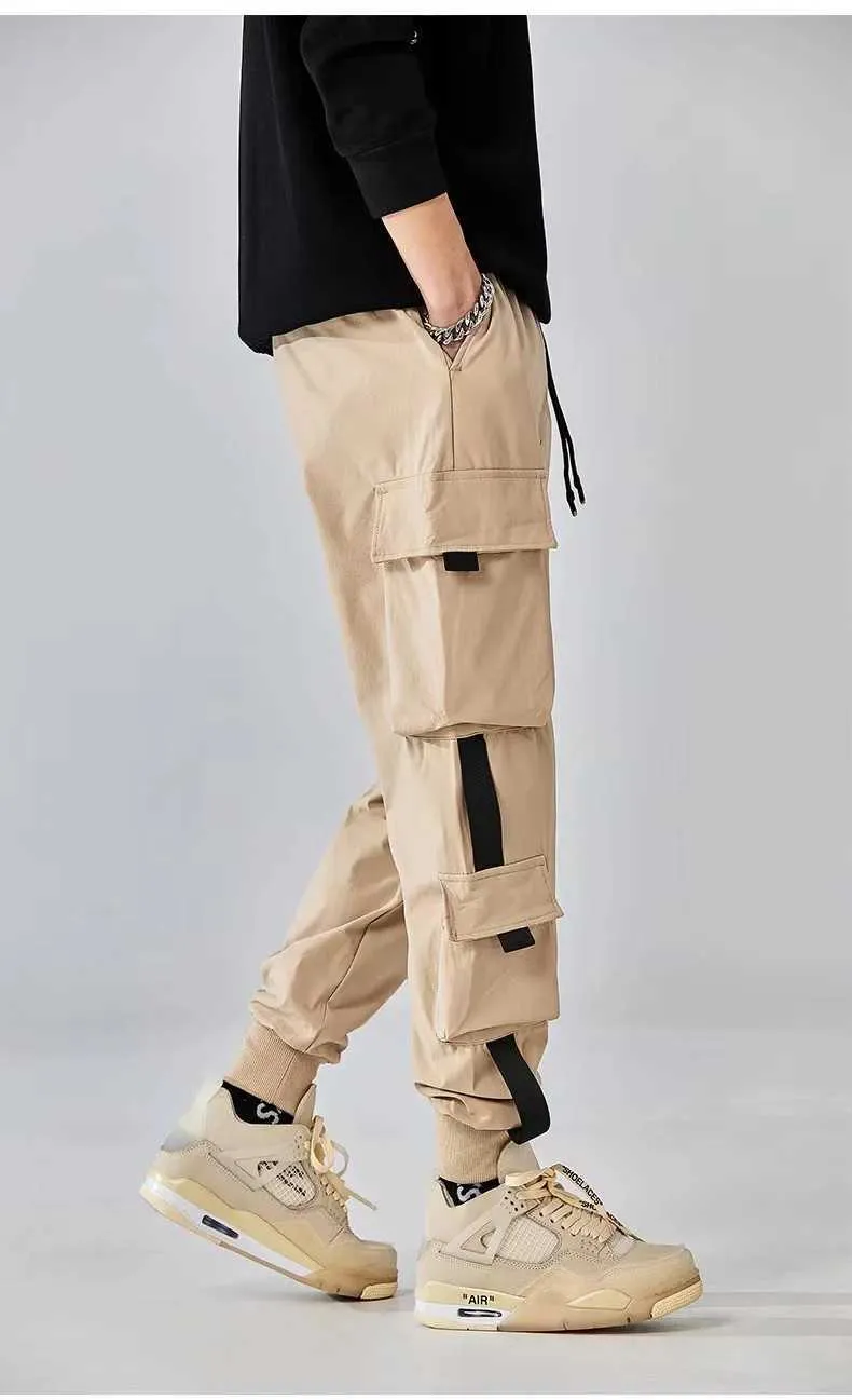 Men's Pants Classic design multi flap pocket cargo jogging pants mens loose fit suitable for dragging harem cargo jogging pantsL2404