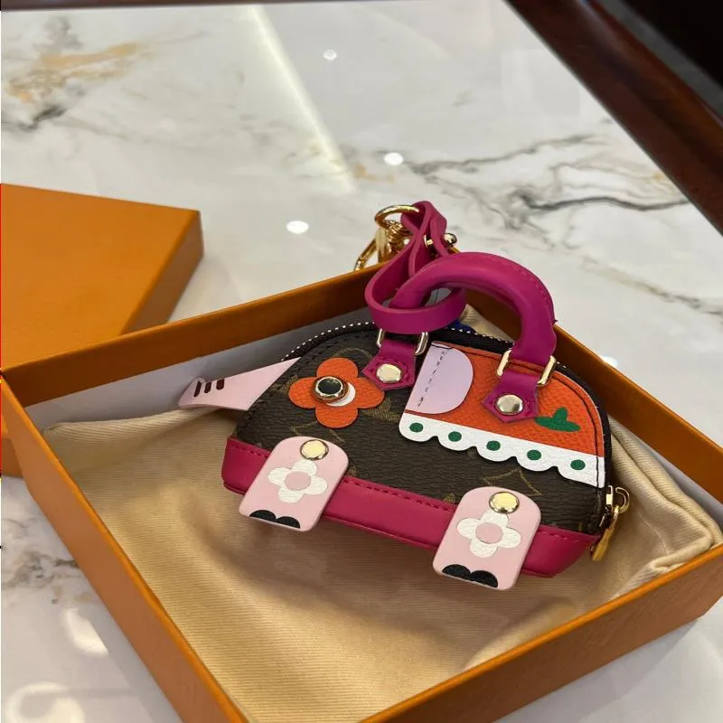 女性の豪華なハンドバッグデザイナーレザーロープ財布キーチェーンスタイリッシュで遊び心のあるスタイルは、バッグデコレーションMFGJWとして使用できます