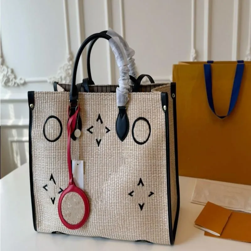 24SS Designer de luxo feminino Summer Limited Straw Tote Bag Sun Salt Sagão Bola de ombro feminina Bag de bolsa de maquiagem HTSG