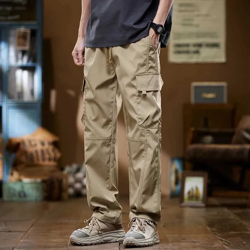 Pantalon masculin Nouveau pantalon de couleur de couleur solide élastique et allastique en liberté à la mode