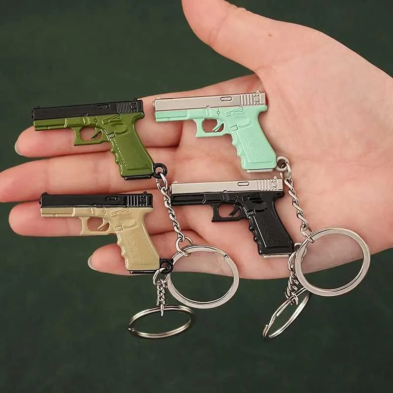 Gun Toys Tot Gun Keychain Alloy G17 P18C Mini All Metal Model Game Surrounding Lights Keychain Pistol Toy Birthday Gift T240428