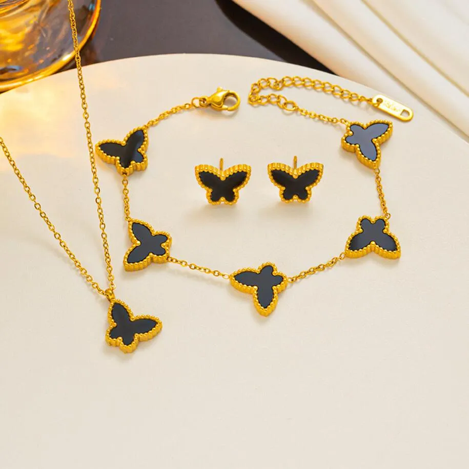 Guldpläterad fjärilsdesigner smycken sätter blommor fyrblad klöver cleef fashional hänge armband örhängen halsband bröllop fest