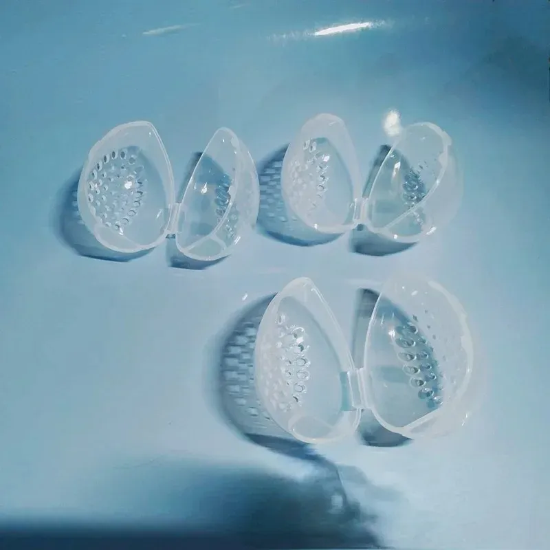 Caja de almacenamiento de esponja de maquillaje vacía Caja de liquidación de placeres de liquidación portátil de plástico en forma de huevo