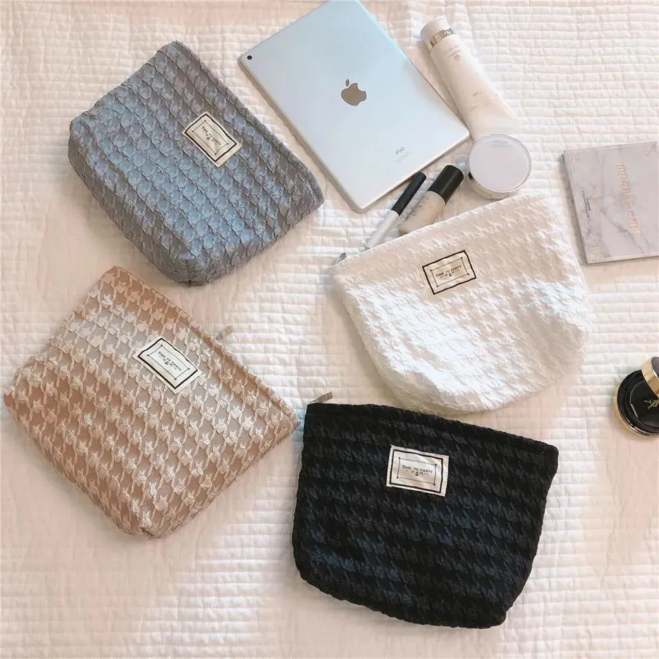 韓国のファッション汎用性のあるハウンドトゥース化粧品バッグトイレットバッグレディースハンドバッグクラッチバッグ