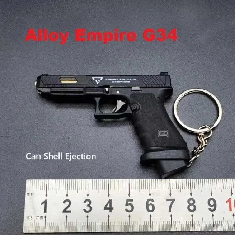 Pistotle Portable Pistolet Model Bieku G17 Pistolet Klapa Mini metalowy pubg M29F Desert Eagle Shell Wyrzucanie swobodnego montażu T240429