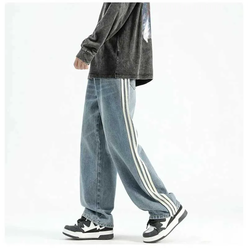 Pantaloni da uomo autunno e jeans sciolti a strisce americane invernali per studenti maschi sciolto tasche per pantaloni a gamba larga dritta J240429