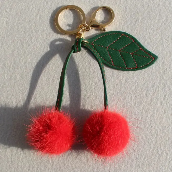 Leuke grappige donzige echte nertsenbont pompom kersenauto sleutelhanger voor sleutels bont pom key chain dames tas charme rugzak hanger 240428